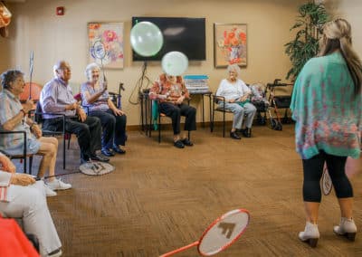 residents playing with balloons
