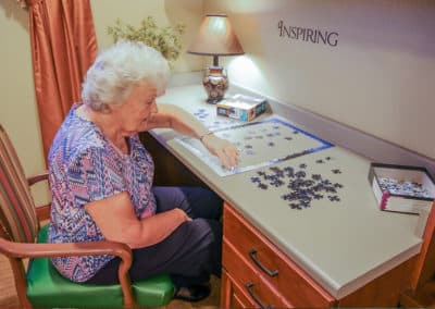 resident playing with a puzzle