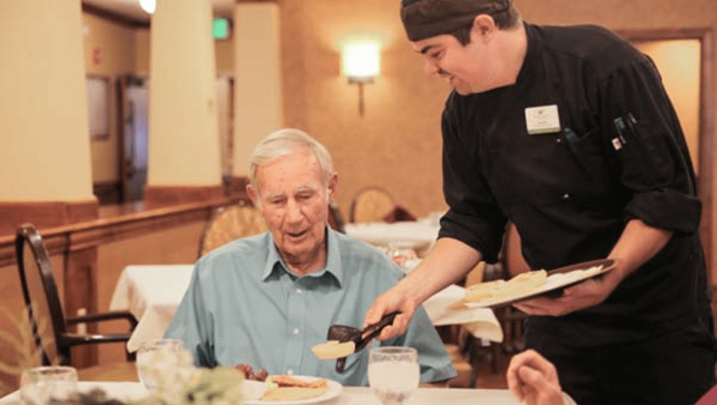 Senior dining at an independent living community eating chef-prepared food