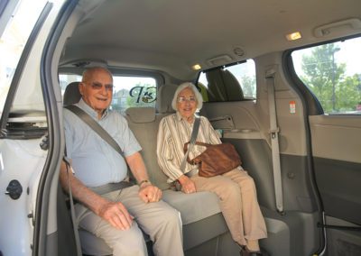 older people in a van